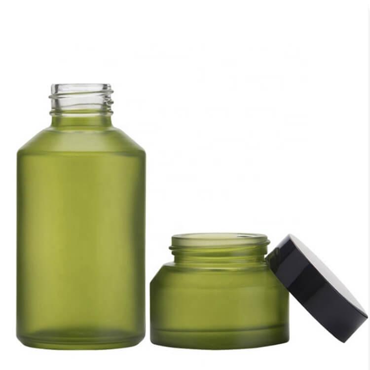 green cosmetic glass bottle