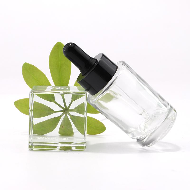 Clear transparent glass essential oil bottle