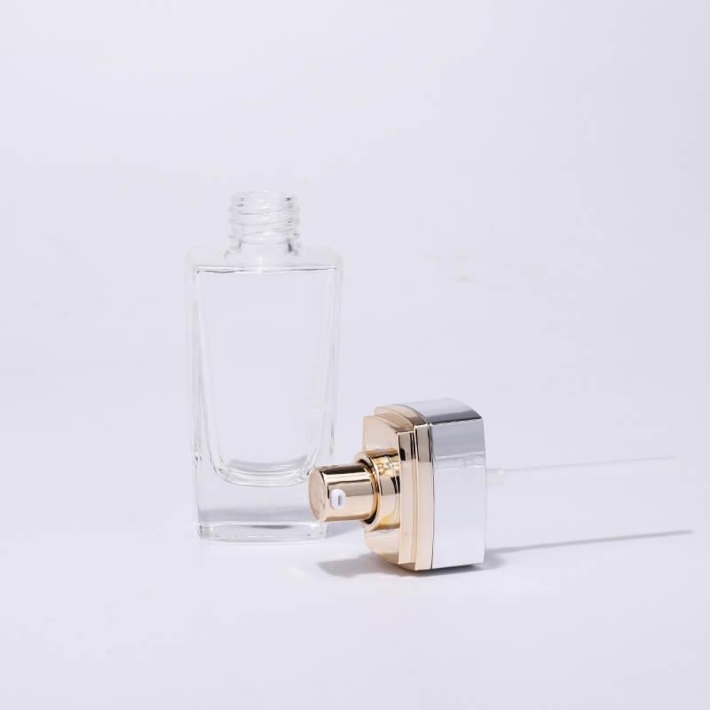Luxury clear gold pump glass bottle